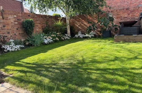 Henley House | A Beautiful River Frontage Townhouse with walled garden, hot tub and fire pit.
