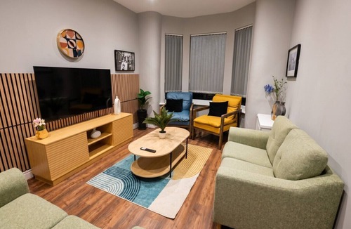 Wigan House | Sleeps six in style with three modern bathrooms, minutes from Wigan town centre