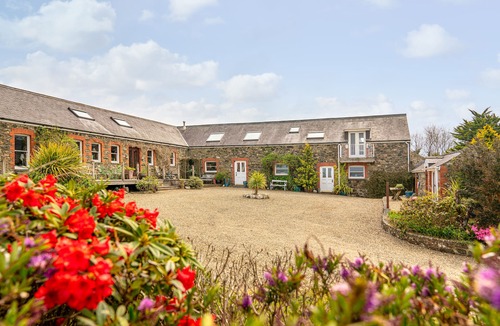 Fishguard House | Spacious converted rural barn. Sea views, large grounds, family & pet friendly.