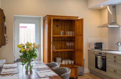 Newcastle Cottage | Stunning restored granite cottage in centre of Newcastle close to beaches etc