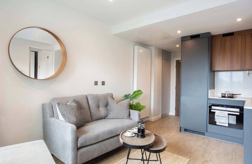 Fairfield Apartment | Workspace & Gym with Skyline View : StayCozy