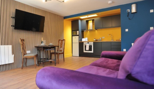 A ground floor studio flat with either double or twin beds, fully equipped kitchen + parking
