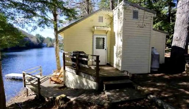 Gorgeous Lakefront Cottage Nestled Amidst Trees in Meredith, New Hampshire in Meredith