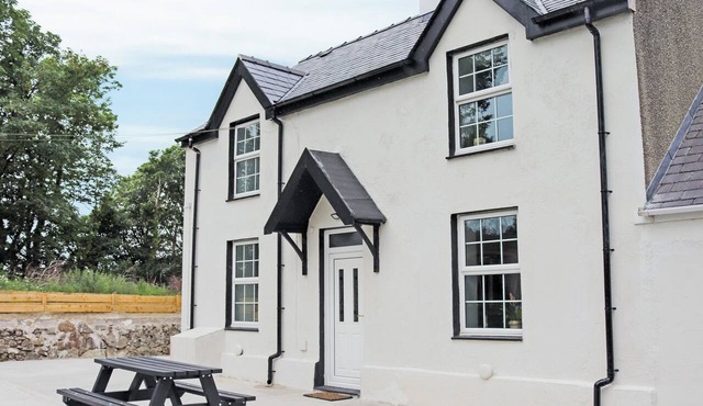 Nestled in serene countryside, this secluded cottage boasts cosy interiors.