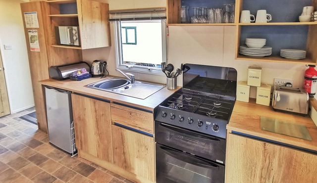 Spacious and well presented 12ft wide caravan with one double and two twin.